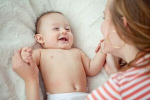 woman and baby smiling