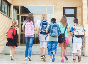 kids walking up school steps
