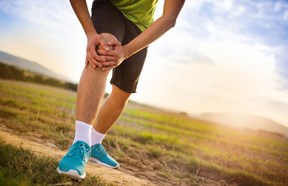 runner holding his knee