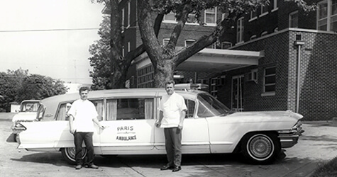 2 men outside a car